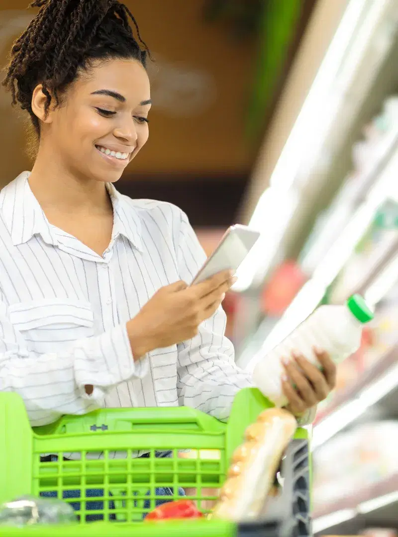 Woman scanning shopping receipt